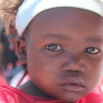 This is one of the girls from the day care centre. As one of the youngest children there, she hadn't seen people like us before and was frightened by our new white faces at first. However, as the day went on, she warmed up to us and we learned how much she actually craved attention.